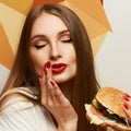 Playful girl posing with burger Royalty Free Stock Photo