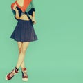 Playful girl in skirt polka dot on blue background. vintage styl Royalty Free Stock Photo