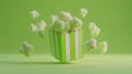 Playful green popcorn exploding from a striped box against a monochrome background Royalty Free Stock Photo