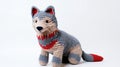 Playful Grey Crocheted Wolf Toy On White Background