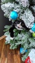 Playful kitty amongst the Christmas tree Royalty Free Stock Photo