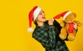Playful lady smiling face. Play with toy. Santa Claus. Pretty woman celebrate christmas. Christmas memories from