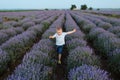 Playful little cute child baby boy walk on purple lavender flower meadow field background, run, have fun, play, enjoy Royalty Free Stock Photo