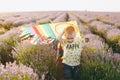 Playful little cute child baby boy walk on purple lavender flower meadow field, run, have fun, play with colorful kite Royalty Free Stock Photo