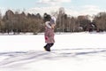 playful little girl playing in the snow on a winter sunny day Royalty Free Stock Photo