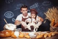 Playful man with daughter making bread