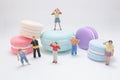 a Playful Miniature People Explore Colorful Macarons Royalty Free Stock Photo