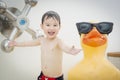 Playful Mixed Race Boy Having Fun at the Water Park Royalty Free Stock Photo