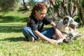 Playful Moments: Red-haired Girl with Pigtails and Her Adorable Black-and-White Dog Enjoying Park Fu Royalty Free Stock Photo