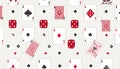A playful pattern of scattered playing cards (various suits and Royalty Free Stock Photo