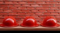 Playful Performance Art: Red Hard Hats On Wooden Counter Royalty Free Stock Photo