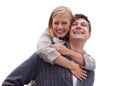 Playful piggybacking. A young woman recieving a piggyback ride from her boyfriend. Royalty Free Stock Photo