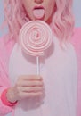 Playful Pink Pajamas Party Girl. Lollipop candy lover. Home Relax style. Kigurumi shop concept Royalty Free Stock Photo