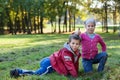 Playful preschool children posing in autumn park, thumb up Royalty Free Stock Photo