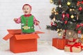 Playful toddler elf enjoying Christmas at home Royalty Free Stock Photo