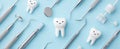 The playful tooth surrounded by dental instruments on a soothing background.AI generated image Royalty Free Stock Photo