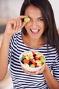 Playful, woman and fruit salad with smile, natural nutrition and healthy organic food. Happy, female person with snack Royalty Free Stock Photo