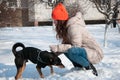 playful woman play with pet in winter. woman pet lover playing with her dog. woman outside with pet Royalty Free Stock Photo