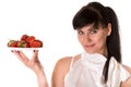 Playful woman with strawberries on plate Royalty Free Stock Photo