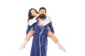 Playful woman twirl moustache riding piggyback on man isolated on white, couple