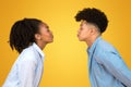 Playful young African American couple giving each other a kissy face, with eyes closed Royalty Free Stock Photo