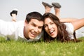 Playful young couple laying down Royalty Free Stock Photo