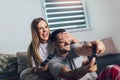 Young couple playing video games in their living room Royalty Free Stock Photo