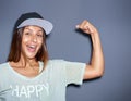 Playful young woman pumping her muscles Royalty Free Stock Photo