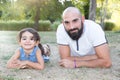 Playfull daughter child with bald man father outdoor