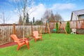 Playground area in the house backyard with swings