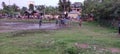 Playground: Boys enjoying play fooball under rain