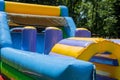 At the playground for children in the park, there is an inflatable attraction for them to enjoy Royalty Free Stock Photo