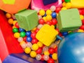 Playground, children`s slides, a play area of colorful plastic balls. Cheerful children`s leisure with balls in the play pool, o Royalty Free Stock Photo