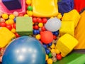 Playground, children`s slides, a play area of colorful plastic balls. Cheerful children`s leisure with balls in the play pool, o Royalty Free Stock Photo