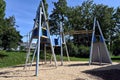 Playground for children with various equipment made of metal, wood and ropes.