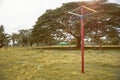 Playground of children and young in a park, selective focus, vintage style filtered image, light and flare added