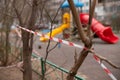 A playground fenced with warning tape.