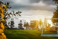 housing development with children\'s playground in the foreground and bright sunbeams from behind Royalty Free Stock Photo