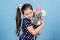 Playground in kindergarten. small girl with soft bear toy. child psychology little girl play game in playroom. toy shop Royalty Free Stock Photo