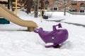 Playground in park without kids, covered with snow in winter season Royalty Free Stock Photo