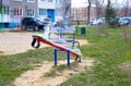 Playground during quarantine - all structures are wrapped with stretch film. swing, sandbox. insulation for children outdoors Royalty Free Stock Photo