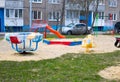 Playground during quarantine - all structures are wrapped with stretch film. swing, sandbox, slide. insulation for children Royalty Free Stock Photo