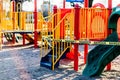 The playground during quarantine is sealed with warning signs, a tape with the word Danger, Coronavirus, Covid-19