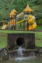 Playground with sewer drain in foeground