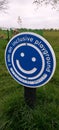 Playground sign in the park blue sign smiley sign