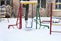 Playground in snow in winter