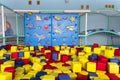 Playground with soft colorful blocks and a blue climbing wall