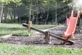 Playground with swings illuminated with sun rays Royalty Free Stock Photo