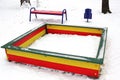 Playground in the winter. Children`s playground in the snow. Sandbox Royalty Free Stock Photo