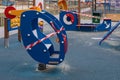 A playground with a wooden helicopter wrapped in barrier tape, stay home. Sanitization of a street sports complex, prevention of